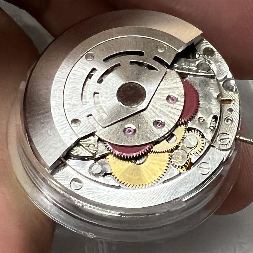 Close-up of VR3135 brand mechanical automatic watch movement, China-made with precise timekeeping features.