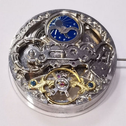 Silver automatic mechanical watch with hollow moon phase at 12 o'clock, elegant 3-hand design