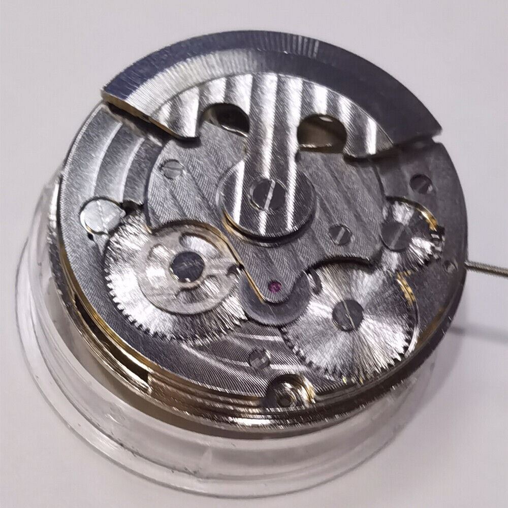 Silver automatic mechanical watch featuring hollow moon phase at 12 o'clock, elegant 3-hand design