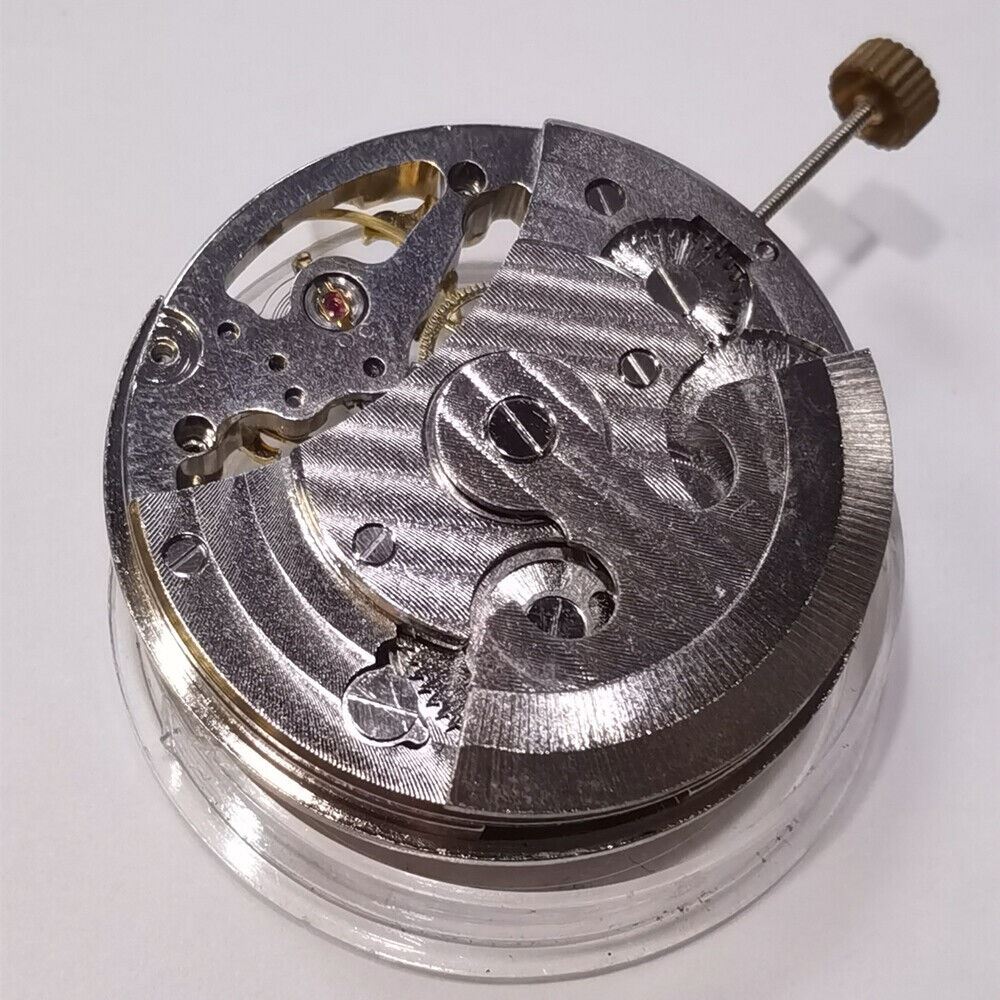 Silver automatic mechanical watch featuring hollow moon phase at 12 o'clock and elegant 3-hand design.