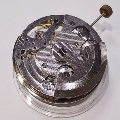 Silver automatic mechanical watch featuring hollow moon phase at 12 o'clock and elegant 3-hand design.
