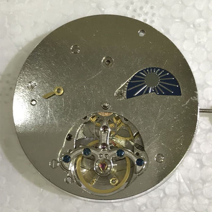 Asian watch accessory showcasing a multi-function tourbillon mechanical movement with moon phase and 24-hour indicators.