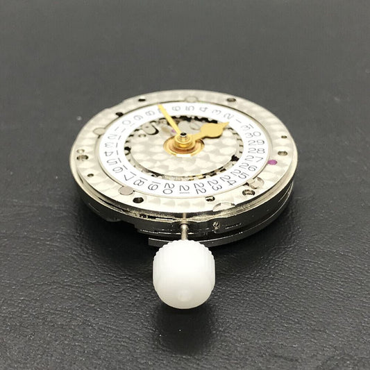 China Made 3186 Automatic GMT watch movement with engraved blue balance spring, precision engineering detail.