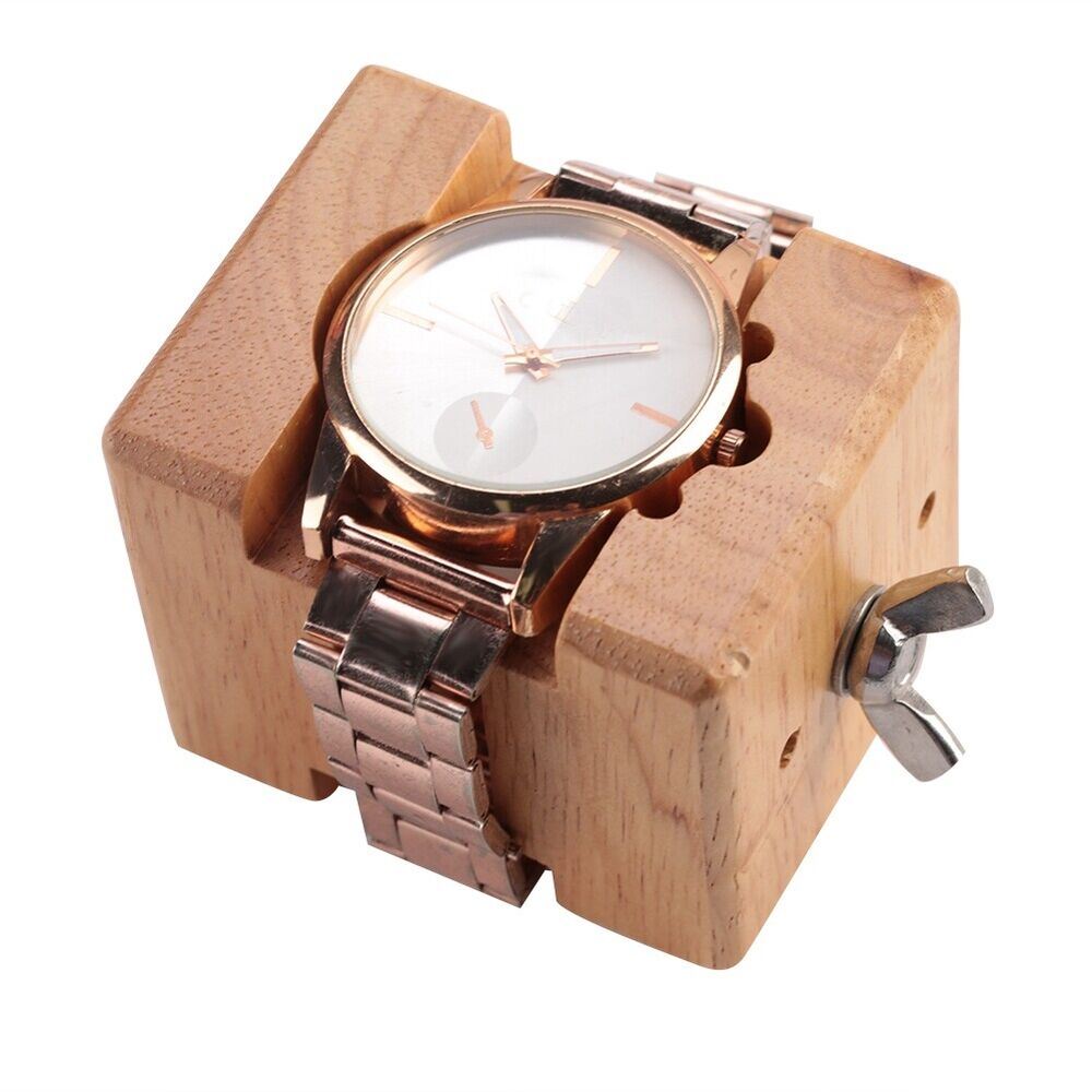 Wooden watch case holder block, ideal for secure watch repair and maintenance tasks.