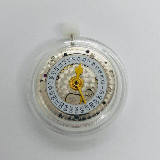 3186 Movement with GMT function and engraved details featuring a blue balance spring for precision timekeeping.