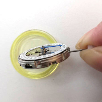 China Made 3804 GMT watch movement showing automatic mechanical date adjustment with 4 hands by brand name.