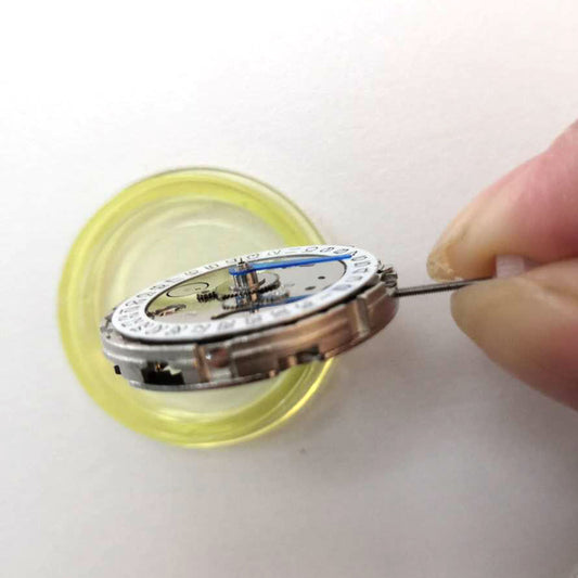 China Made 3804 GMT watch movement showing automatic mechanical date adjustment with 4 hands by brand name.