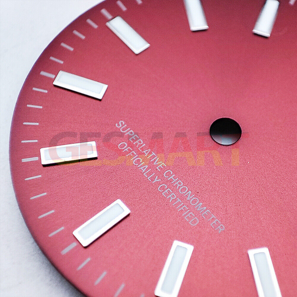 Green luminous polished metal watch dial with red accents for NH35 movement, ideal for custom watch builds.