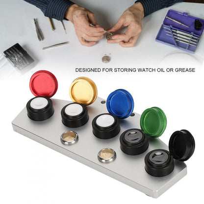 Set of 5 watch oiler cups with covers, ideal for precise oil storage in watch repair.