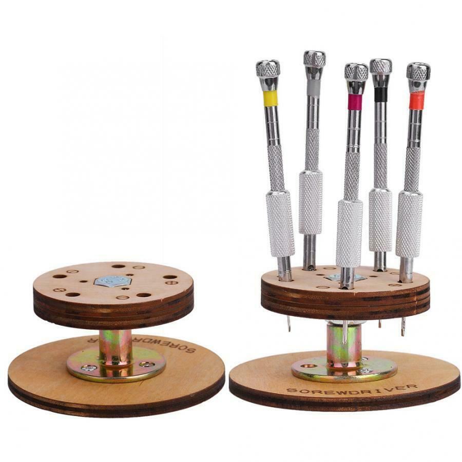 1. Set of 5 steel watchmaker screwdrivers with rotary stand base for precision repairs.