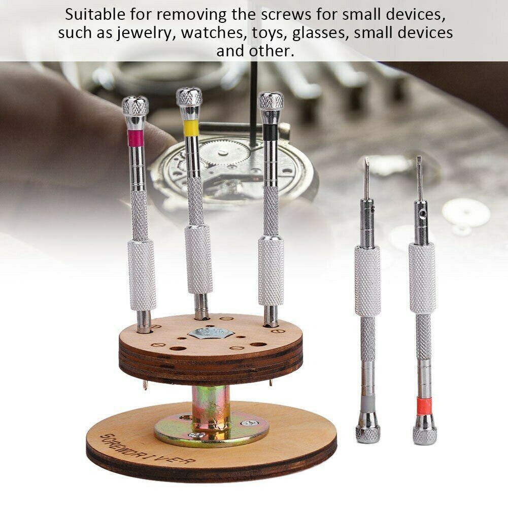 Set of 5 steel watchmaker screwdrivers on rotary stand for precise watch repairs.
