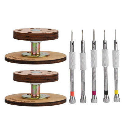 Set of 5 steel watchmaker screwdrivers on a rotary stand for precise watch repairs.