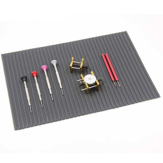 Heat-resistant non-slip pad mat 30mm x 21mm for watch repair, with adhesive back for secure placement.