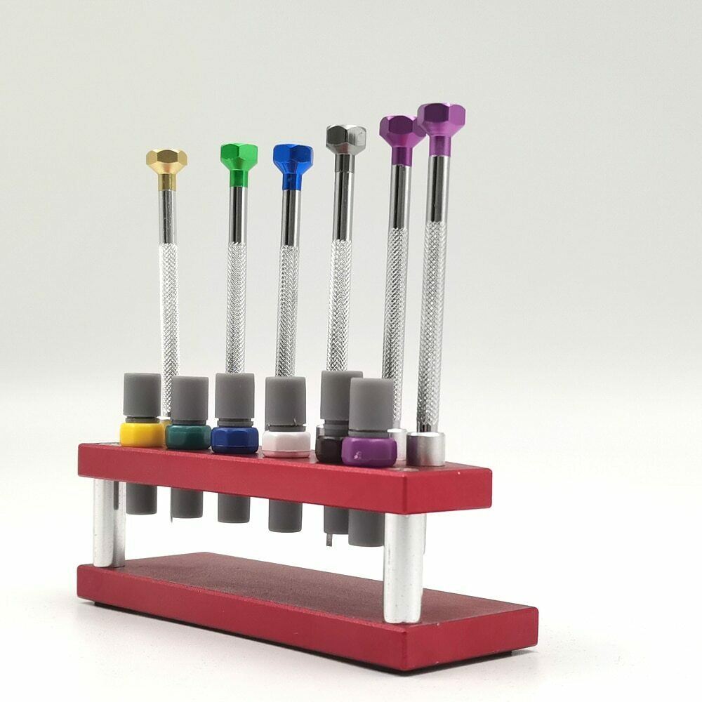 Precision watch screwdriver set with extra blades and stand for watch repair and maintenance tasks.