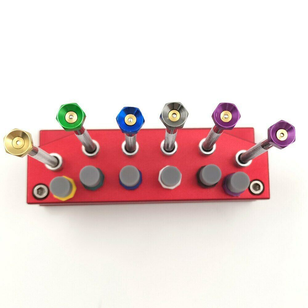 Precision watch screwdriver set with extra blades and stand for watch repair and maintenance.