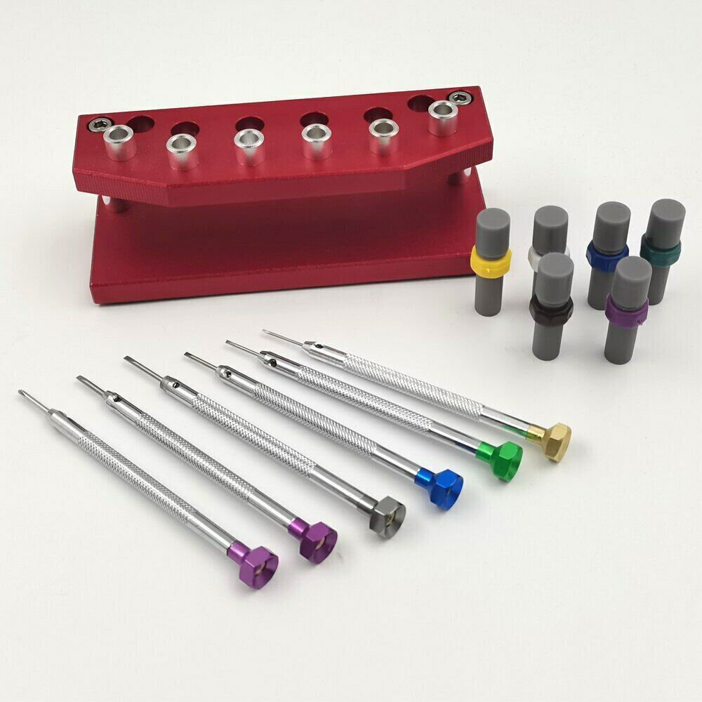 Precision watch screwdriver set with extra blades and stand for watch repair and maintenance.