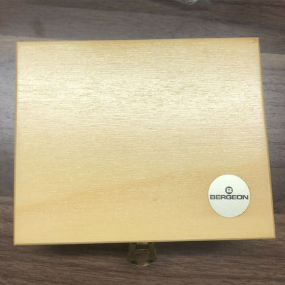 Bergeon 5355 Swiss mainspring winder set in wooden box for precise watch repair tasks.