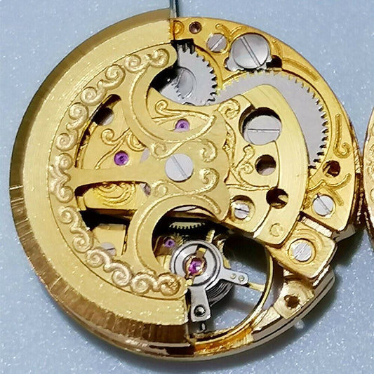 26.5mm 7120 automatic mechanical watch movement with carved hollow design in gold finish.