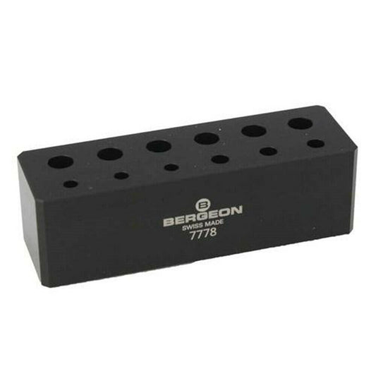 Bergeon 7778 6-piece watch screwdriver set with spare blades and organized stand for precision repair tasks