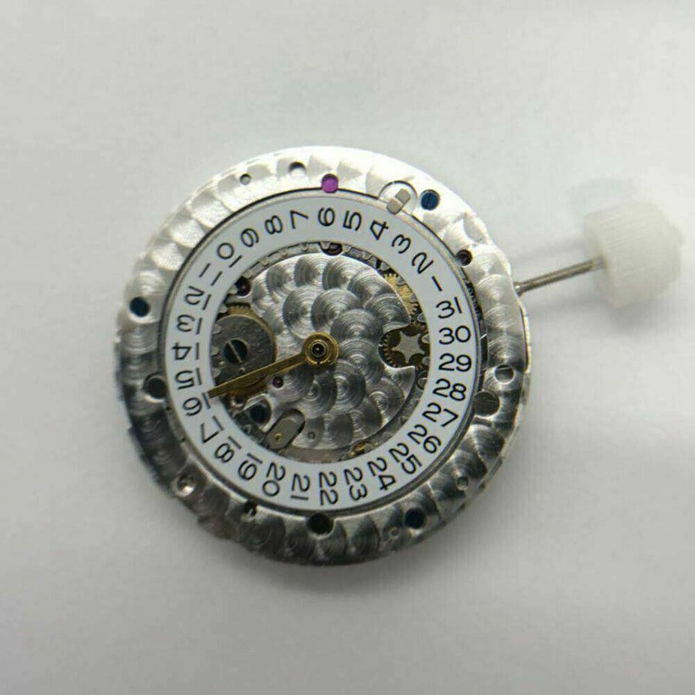SH3135 watch movement with detailed engraving and blue balance spring, highlighting precision craftsmanship.