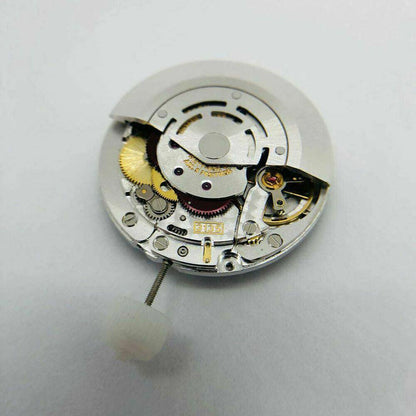 SH3135 watch movement with detailed engraving and blue balance spring, highlighting Seiko?s precision engineering.