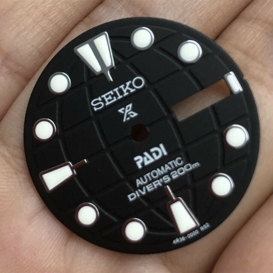 Black 28.50mm luminous watch dial for NH35 movement, enhancing visibility and style.