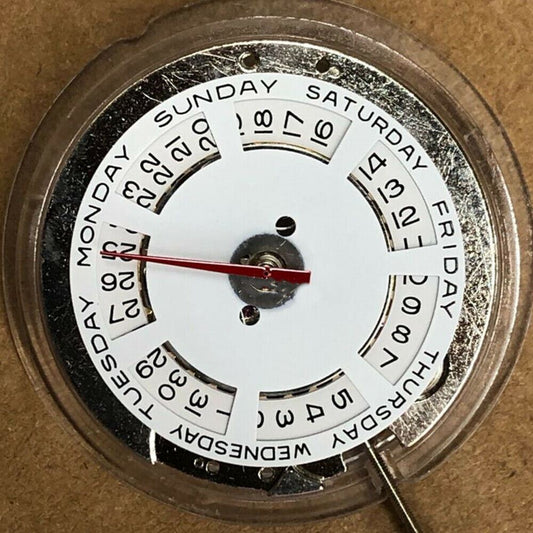 China Made ST2147 automatic mechanical watch movement showing day at 12 o'clock and date at 3 o'clock.