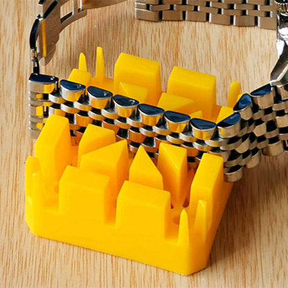 1. Set of 3 watch band holders and pin removers for precise strap repairs.  