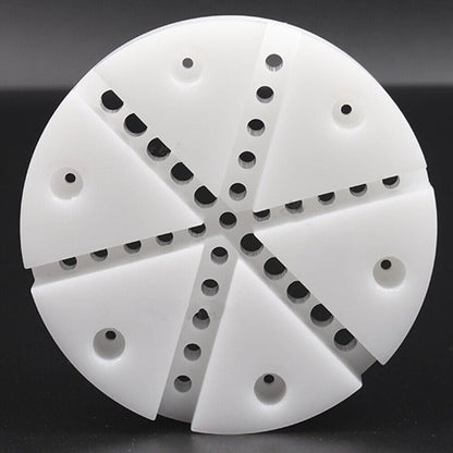 White watch band holder with strap pins remover tool for easy watch repair and bracelet adjustments.