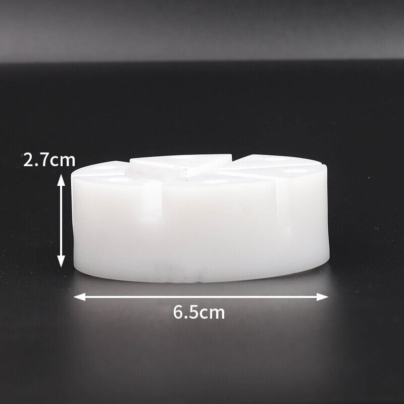 White watch band holder with strap pins remover tool for easy watch repair and bracelet adjustments.