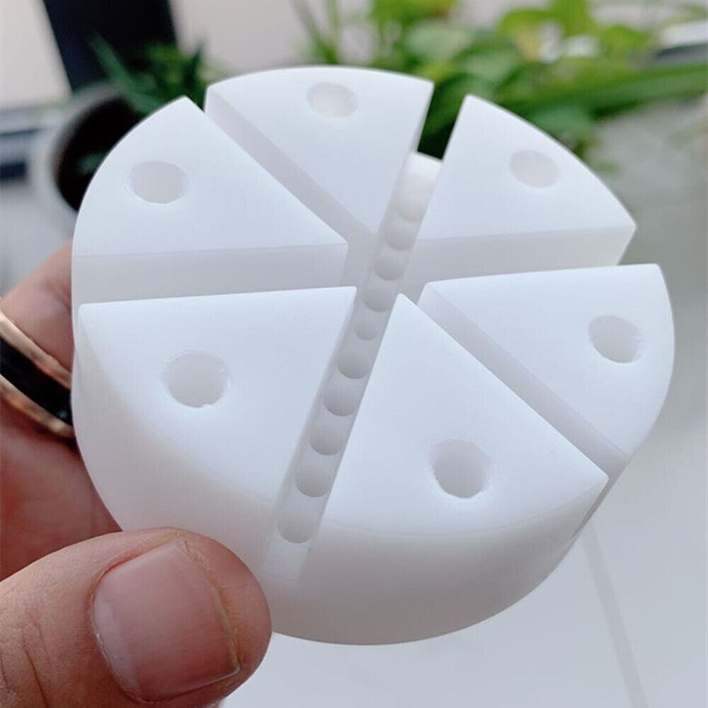 Plastic watch band holder with pin remover for easy watch strap repair and adjustment.