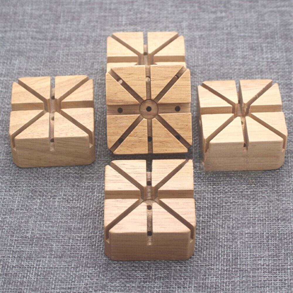 Wooden watch band holder with pins remover for easy watch strap repairs.