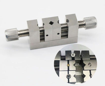 Multi-hole clamp tool for precise watch crown positioning and repair tasks.