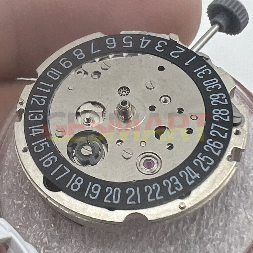 Miyota/Citizen 8215 automatic watch movement with black dial and date at 6, precision Japanese engineering.