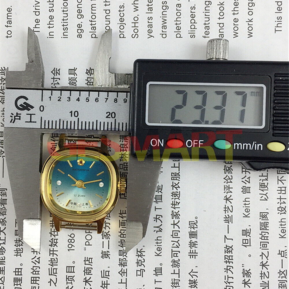 Manual mechanical lady watch with golden square case, gradient blue dial, and 3 hands.