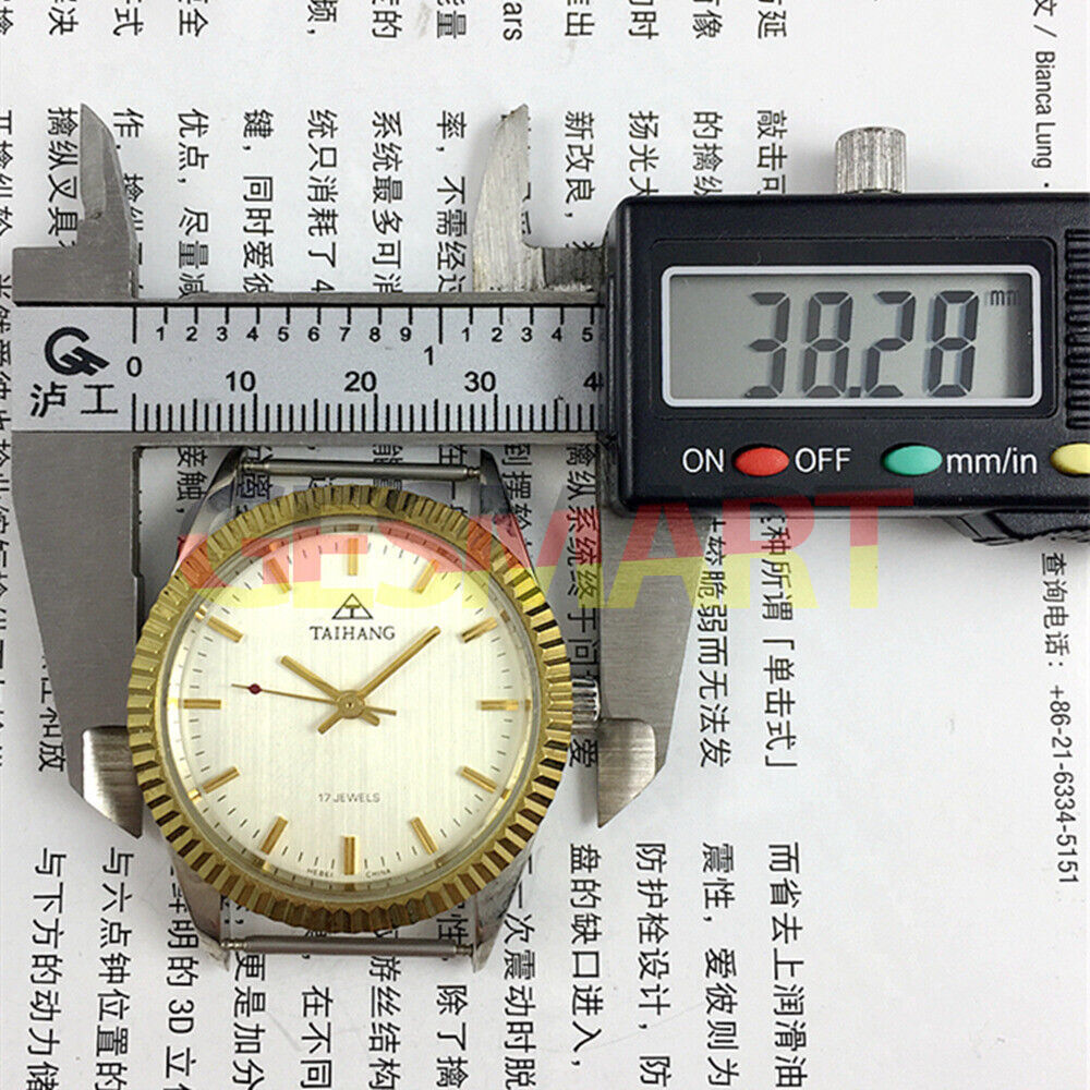 38mm TAIHANG manual mechanical watch with silver dial, gold nail markers, and precise 17 jewels movement.