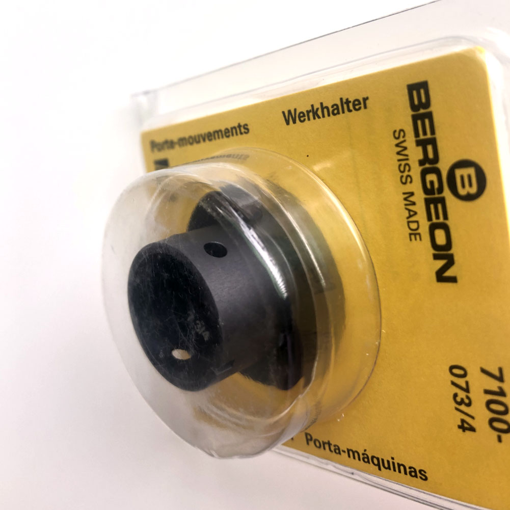 Bergeon 7100-07 watch movement holder securing standard parts for precise repair and assembly.