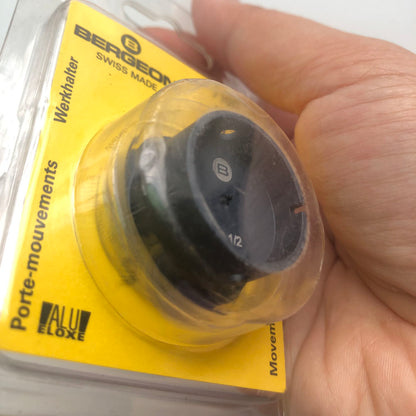 Bergeon 7100-10 watch movement holder securely supports standard watch movements during repair and assembly.