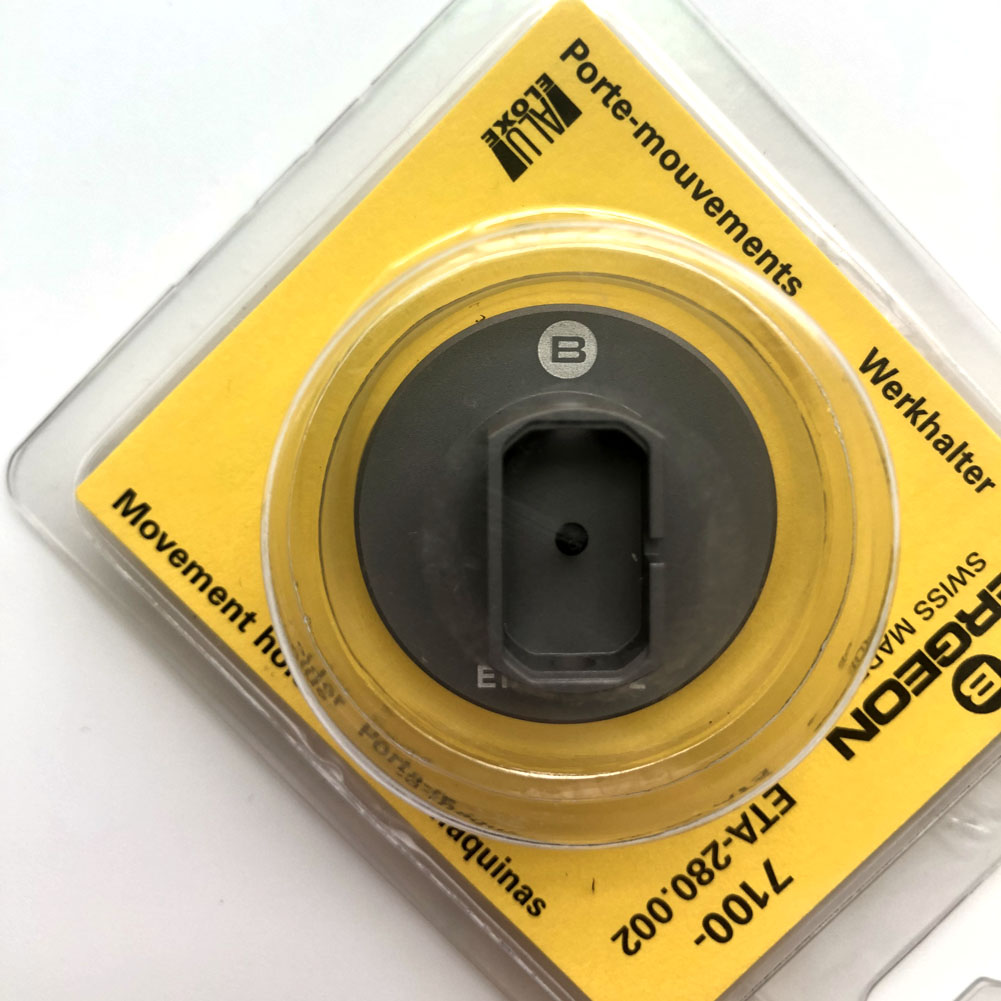Bergeon 7100 watch movement holder securing ETA 280.002 for precise repair tool use.