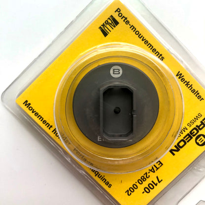 Bergeon 7100 watch movement holder securing ETA 280.002 for precise repair tool use.