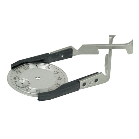 Bergeon 7140 cross locking tweezers holding watch crystals and dials for precise accessory handling.