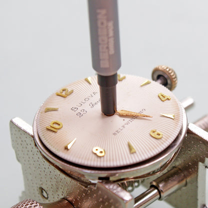 Bergeon 7404-S03 watch hand fitting tools set with sturdy base for precise repair and assembly.