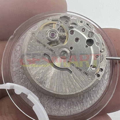 Miyota/Citizen 8215 automatic watch movement with black dial, date at 6, precision Japanese craftsmanship.