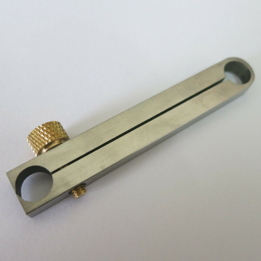 Centre wheel clamp tool for precise watch movement repair and assembly.