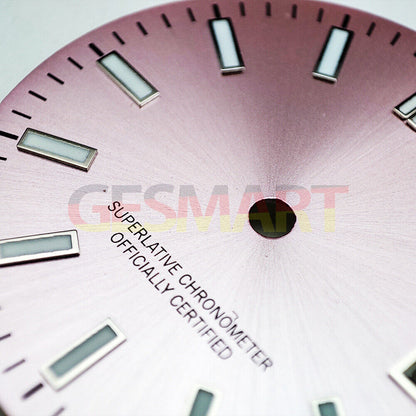 Green luminous polished pink watch dial for NH35 movement, sleek metal design.