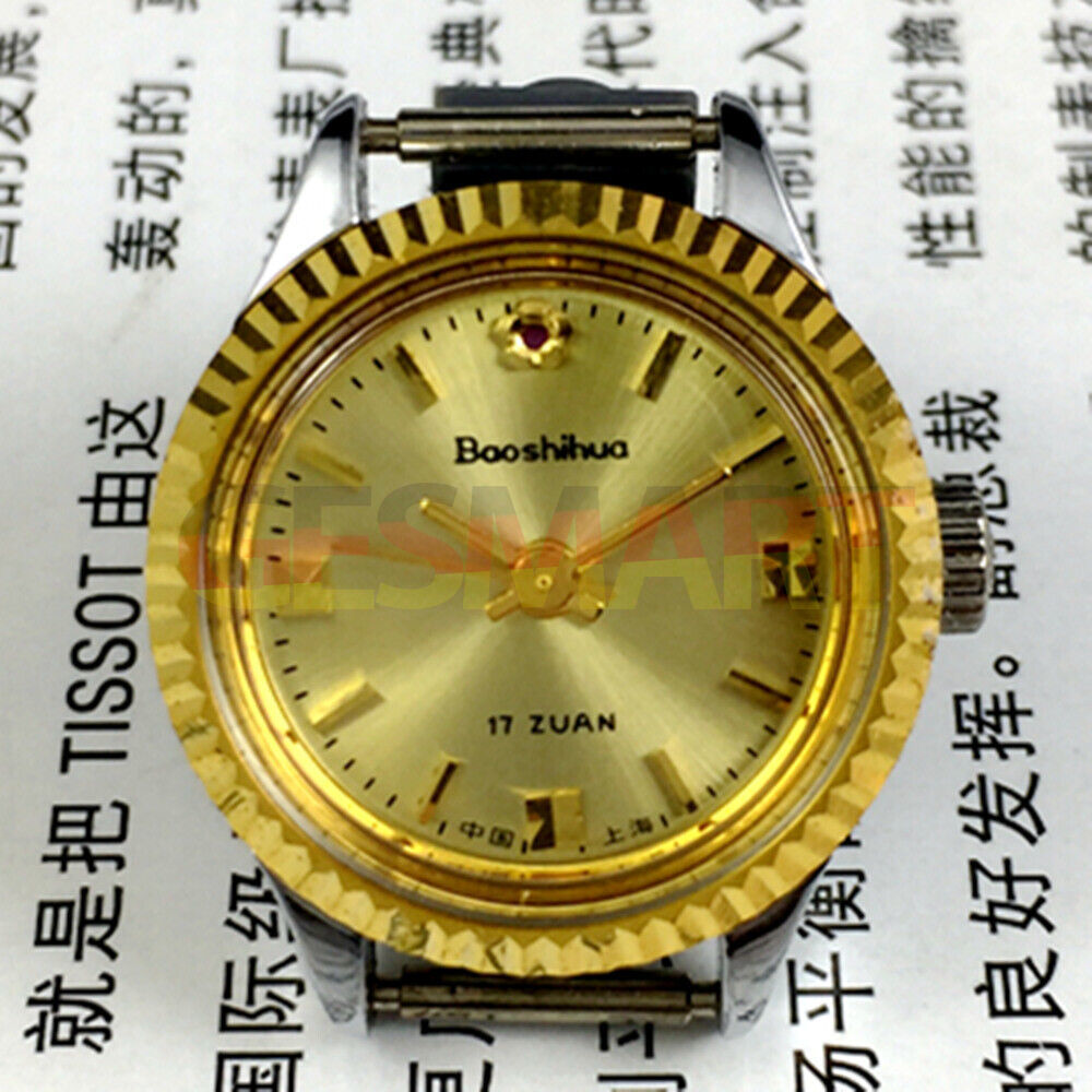 Shanghai 24mm ladies manual watch with golden nail markers, round gold case, and 3-hand movement.