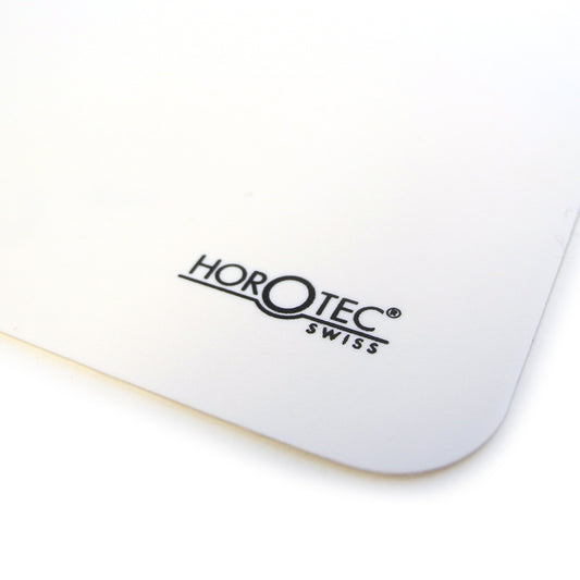 Horotec MSA24.207 white self-adhesive bench mat, 350mm x 240mm, anti-slip surface for watch repair workspace.