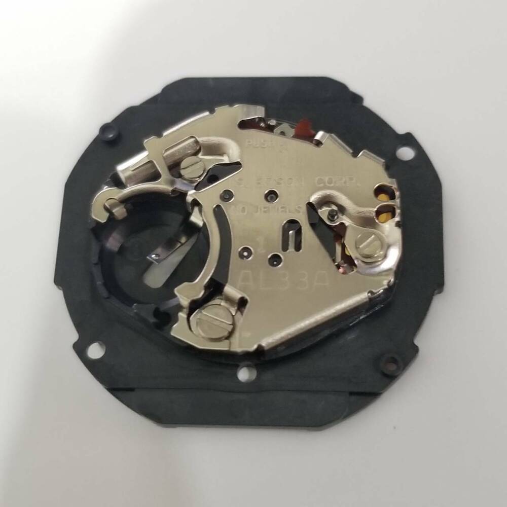 S. Epson AL33 quartz watch movement, precise repair part for accurate timekeeping in watches.