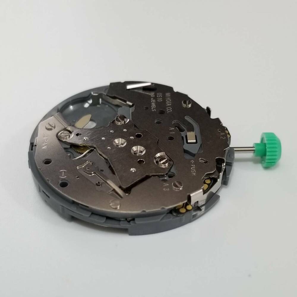 Miyota 0S10 quartz watch movement, precise replacement part for watch repairs and upgrades.