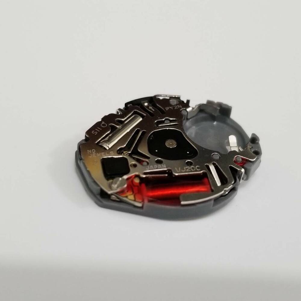 Hattori Epson TMI VJ20 quartz watch movement, Japan-made, precise timekeeping for watch repair.